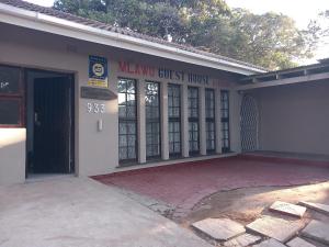 a miami guest house building with a garage at Mlawu Guest House in Margate