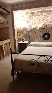 Postel nebo postele na pokoji v ubytování Guest house La Corte Normanna