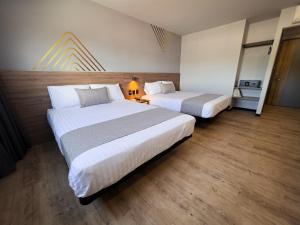 Katil atau katil-katil dalam bilik di Avanta Hotel & Villas Querétaro