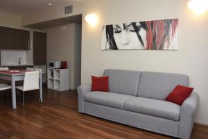 a living room with a couch and a table at Residence Nazionale Matera in Matera +70 photos