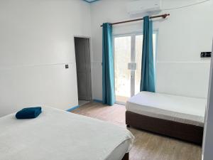 Voodi või voodid majutusasutuse Ithaa Seaview toas