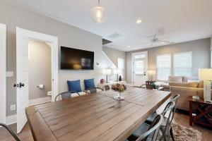 a dining room and living room with a table and chairs at Peabody House in Wilmington