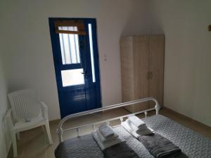 Postel nebo postele na pokoji v ubytování Kelia Analipsis