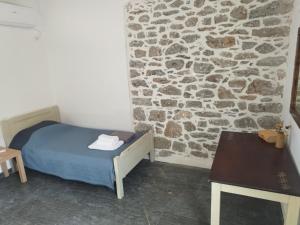 Postel nebo postele na pokoji v ubytování Kelia Analipsis