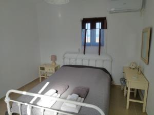 Postel nebo postele na pokoji v ubytování Kelia Analipsis