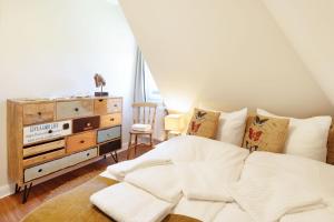 Postel nebo postele na pokoji v ubytování Sonnenhüs