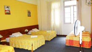 Cama ou camas em um quarto em Novo Bonbini