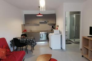 A kitchen or kitchenette at Gîtes chez Sylvie