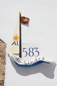 Naktsmītnes Al 583 di Lindos logotips vai norāde