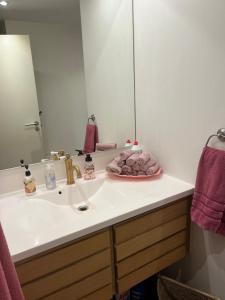 a bathroom with a sink and a mirror at Hygge in Copenhagen