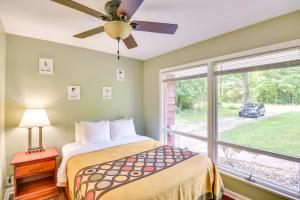 a bedroom with a bed and a window at 5 Mi to Warren Dunes - Secluded Sawyer Home! in Sawyer