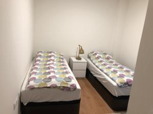 two beds sitting next to each other in a room at Luxury Apartment in Fuengirola
