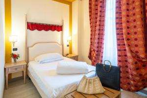 Postel nebo postele na pokoji v ubytování Hotel Manzoni Wellness&Spa