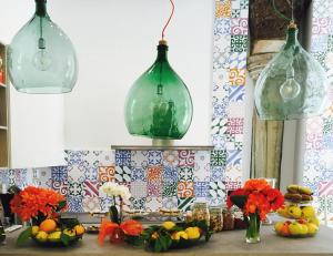 two glass pendant lights hanging over a kitchen counter at Sorrento Flats in Sorrento