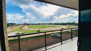 a view from a window of a parking lot at Hotel Nova Aliança in Chapadão do Sul