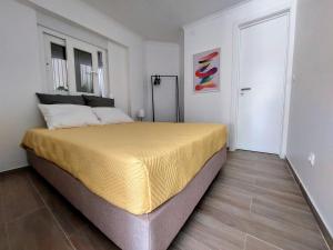 a bedroom with a large bed in a room at Caparica Studio - Sclusive Stay in Costa da Caparica