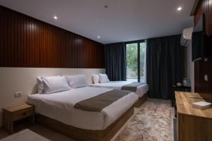 Voodi või voodid majutusasutuse Pyramid Front Hotel toas