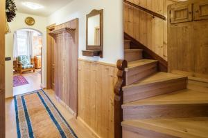 a staircase in a home with wood paneling at CiasaToa in Cortina dʼAmpezzo