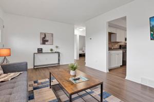 a living room with a table and a couch at The Northtowne Getaway in Columbus