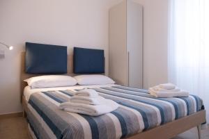 Voodi või voodid majutusasutuse Nautika Suites toas