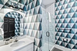 a bathroom with a sink and a shower at Downtown Kentucky Home Perfect for Groups in Louisville +61 photos