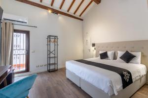 Postel nebo postele na pokoji v ubytování SOHO Piaggiarelle by Dasso - Guest House