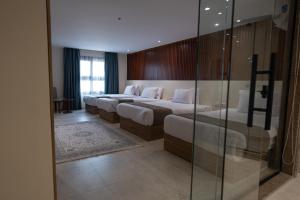 Voodi või voodid majutusasutuse Pyramid Front Hotel toas