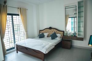 Postel nebo postele na pokoji v ubytování Poolside Villa