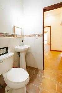 a bathroom with a toilet and a sink at Hotel Casa San Pablo in Oaxaca City +52 photos