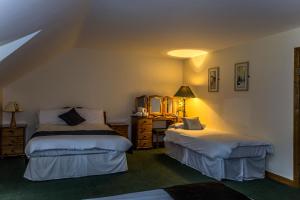 Voodi või voodid majutusasutuse Percy French Hotel toas