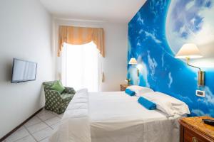 Postel nebo postele na pokoji v ubytování Hotel Manzoni Wellness&Spa
