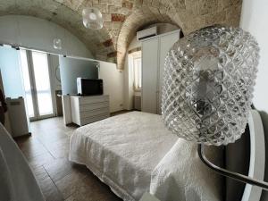 a bedroom with a bed and a large orb at Egnazia holiday in Fasano