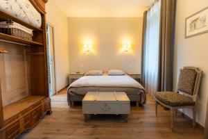 Postel nebo postele na pokoji v ubytování Maison d hôtes L école