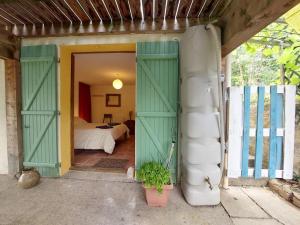 an open door to a room with a bed at Vue de Rennes-le-Château in Couiza