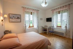 Postel nebo postele na pokoji v ubytování Maison d hôtes L école