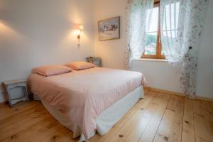 Postel nebo postele na pokoji v ubytování Maison d hôtes L école