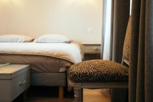 Postel nebo postele na pokoji v ubytování Maison d hôtes L école