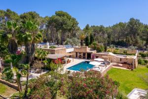 an aerial view of a house with a swimming pool at Villa Sa Tanca IBIZA located PUIG D'EN VAll, 6B , Pool , Tennis in Montecristo