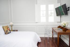 Uma TV ou centro de entretenimento em Casa Republica Barranco Boutique Hotel