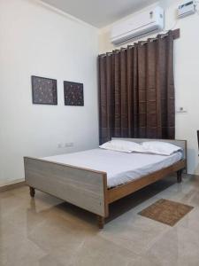a bedroom with a bed in a room at ECR 1 Spacious 3BHK Villa with Swimming pool in Chengalpattu