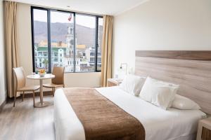 Postel nebo postele na pokoji v ubytování Terrado Arturo Prat Iquique