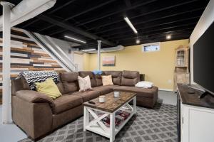 a living room with a couch and a table at Suburban Sanctuary 3BD Perfect for Long Stays in Pekin
