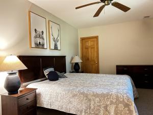 a bedroom with a bed and a ceiling fan at The Fox Den in Terra Alta +40 photos