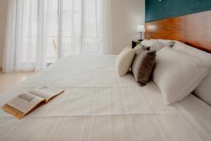 Una cama o camas en una habitación de Itzamna luxury condos whit ocean viewpool