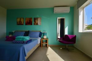 Postel nebo postele na pokoji v ubytování Blue Bay Beach Villas & Apartments