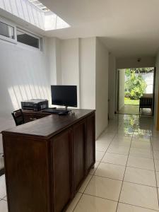 a room with a desk with a computer on it at Villa Nola in Guatemala