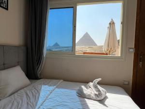 Tamara Front Pyramids & Valley Temple View客房内的一张或多张床位