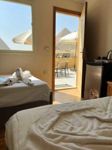 Tamara Front Pyramids & Valley Temple View客房内的一张或多张床位