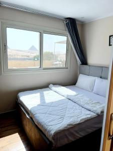 Tamara Front Pyramids & Valley Temple View客房内的一张或多张床位