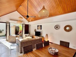 a living room with a couch and a table at Searenity Villa in Grand-Baie